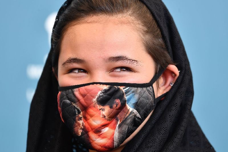 Iranian actress Shamila Shirzad wears a face mask during a photocall for the film â€œKhorshidâ€ (Sun Children) presented in competition on the fifth day of the 77th Venice Film Festival, on September 6, 2020 at Venice Lido, during the COVID-19 infection, caused by the novel coronavirus. (Photo by Tiziana Fabi/AFP Photo)